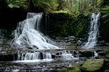 Huge Waterfall In Forest